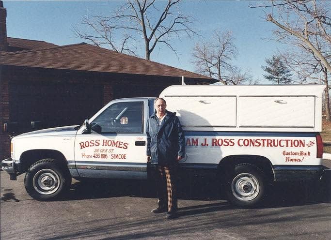 Bill Ross beside the Ross Homes pickup truck, Simcoe