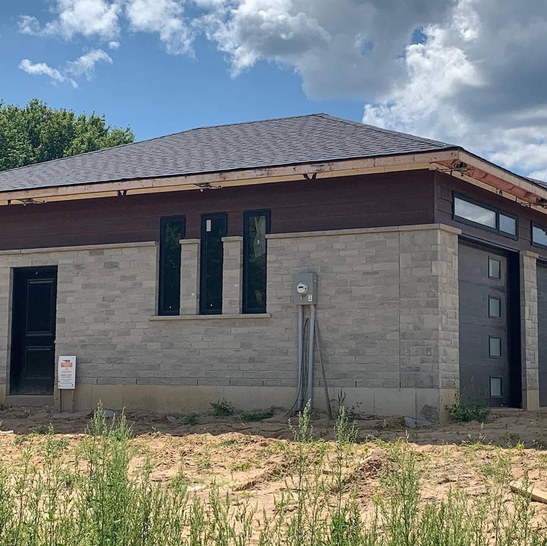 A Ross home under construction, stone and timber, Norfolk County